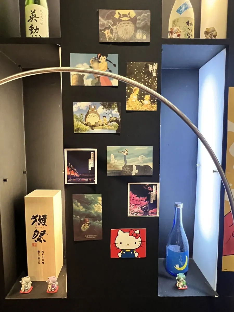 Ito's wall covered with whisky posters and decor