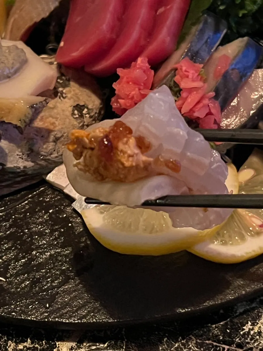 A sashimi plate with sorted varieties of fish