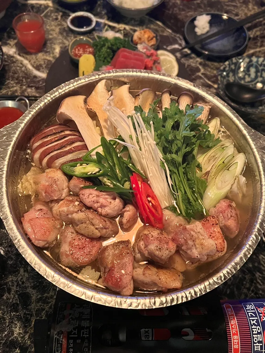 A piece of sashimi placed on top of rice