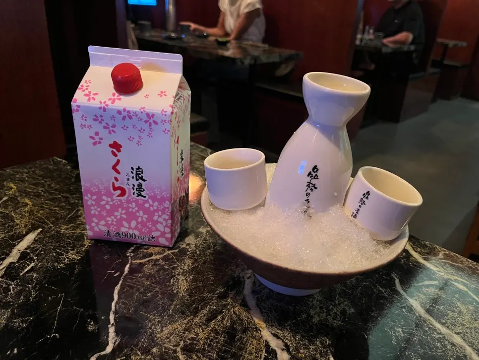 Sakura Roman sake tokkuri set in a bowl of ice