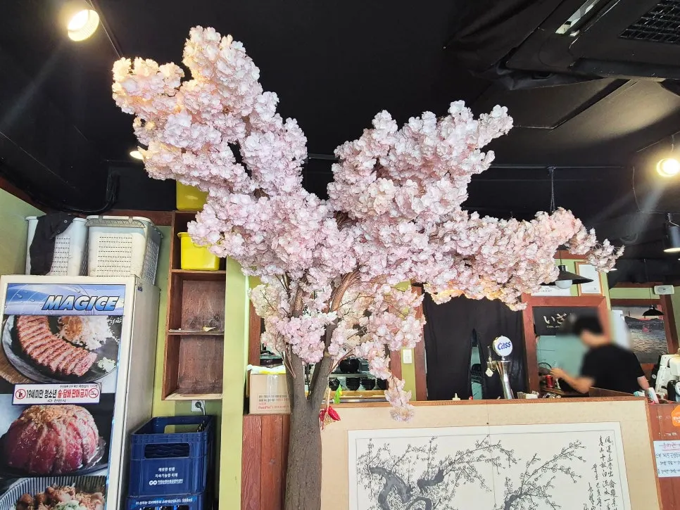 One side of the restaurant decorated with cherry blossom tree interior