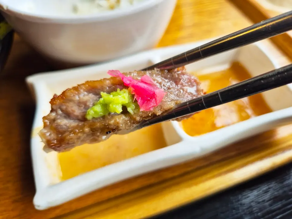 A bite taken out of the tender gyukatsu
