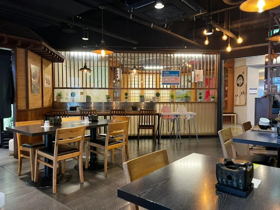 Interior of Izawa with table seats and bar seating
