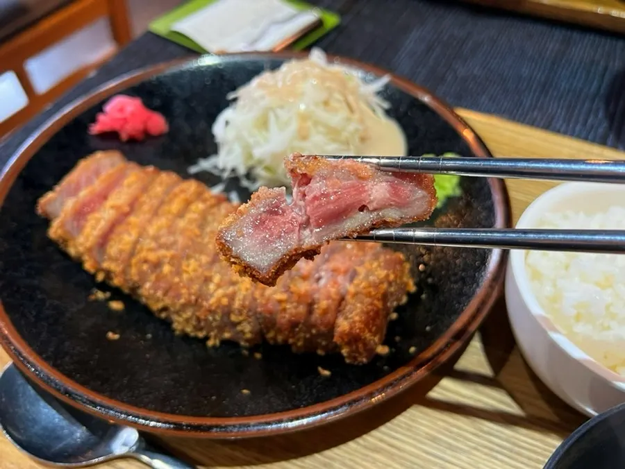 Cross-section of gyukatsu, crispy outside and rare inside