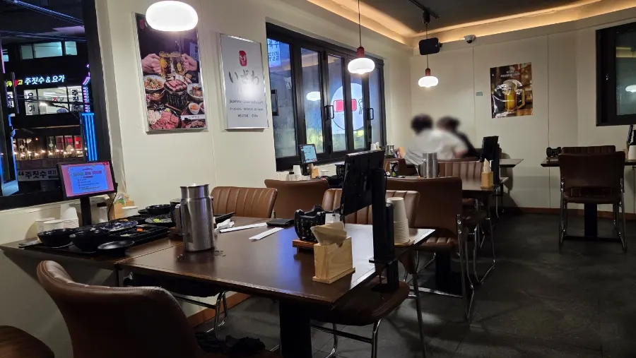 Second floor space with tables at Izawa Sangam