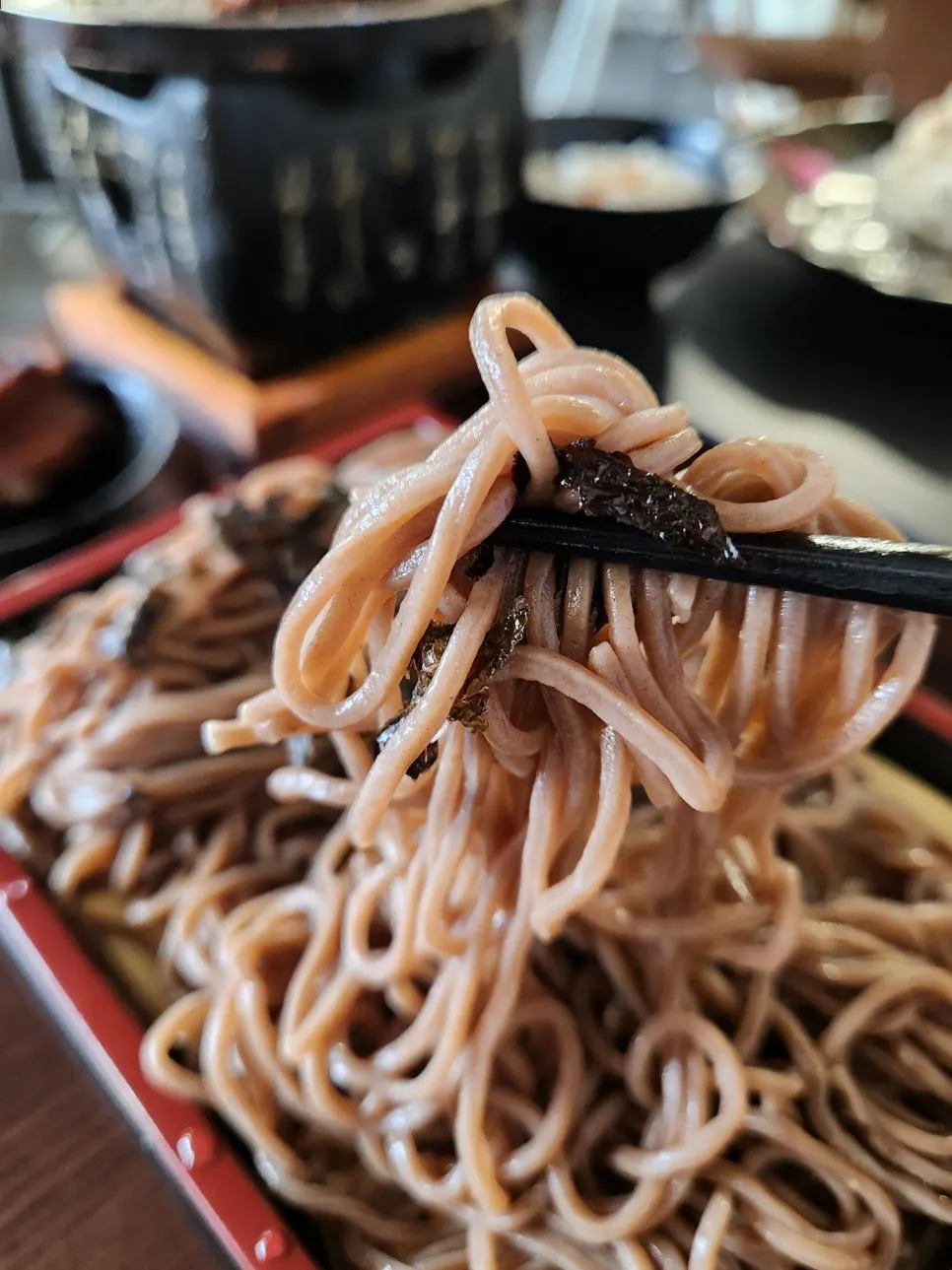 A bowl of cold soba dipped into icy broth