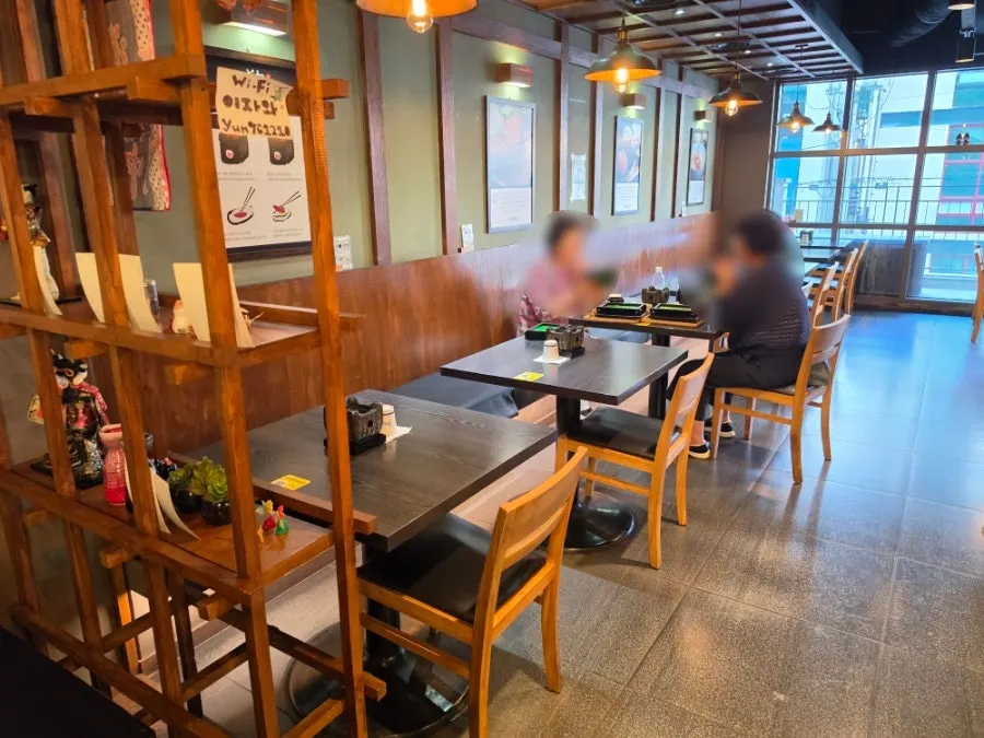 Two-seater tables and window bar seats at Izawa
