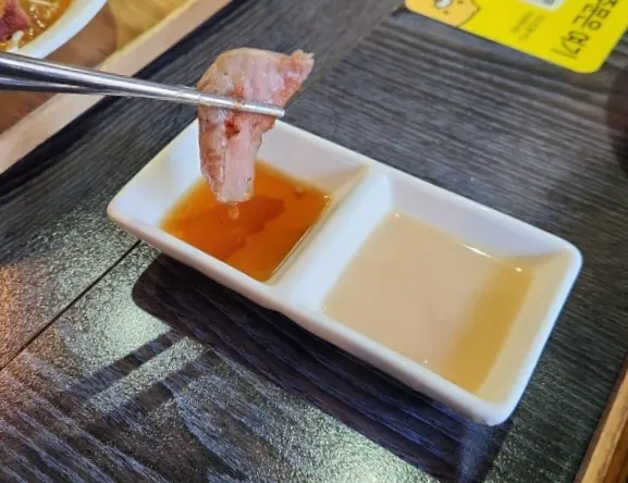 Steak dipped in soy-based sauce