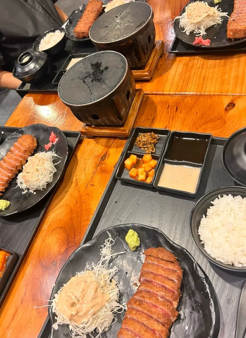 Flames rising from the Izawa gyukatsu grill