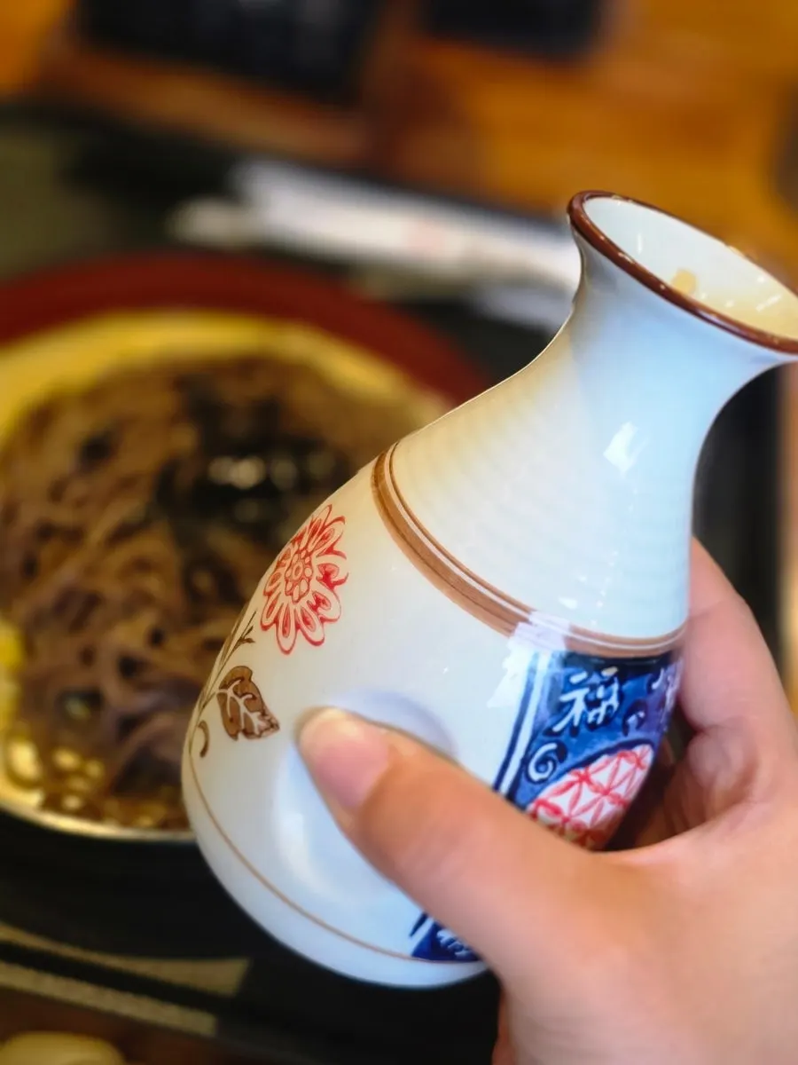 Izawa's pan-momil table setting with two bowls of broth
