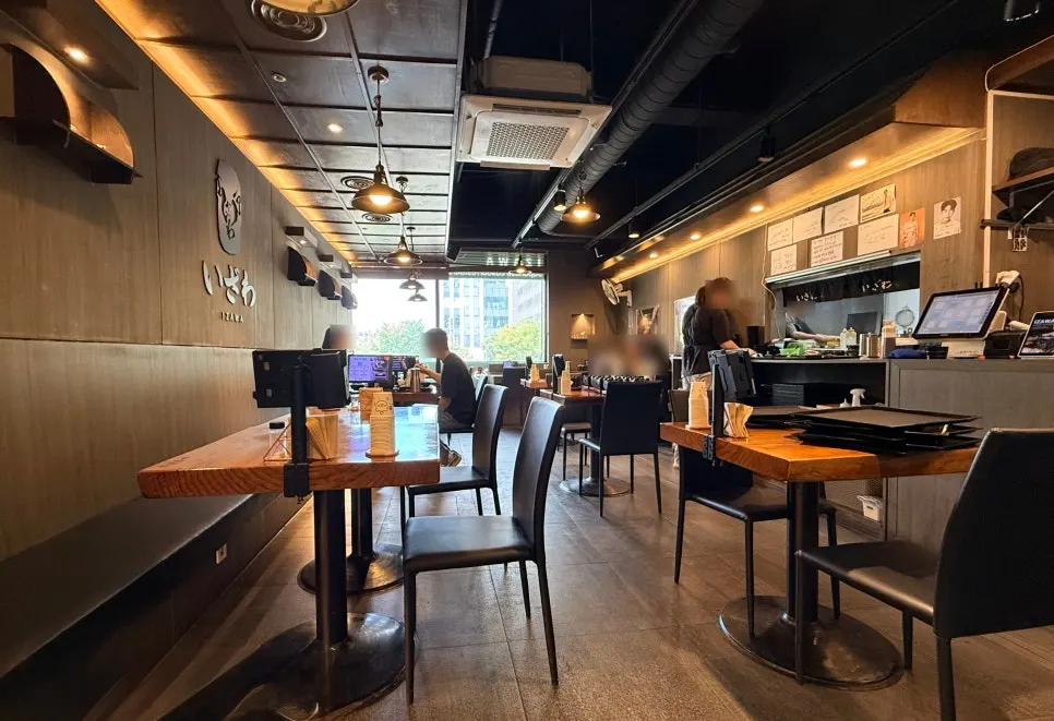 Interior of Izawa Yeouido Direct Store decorated in brown and wood tones