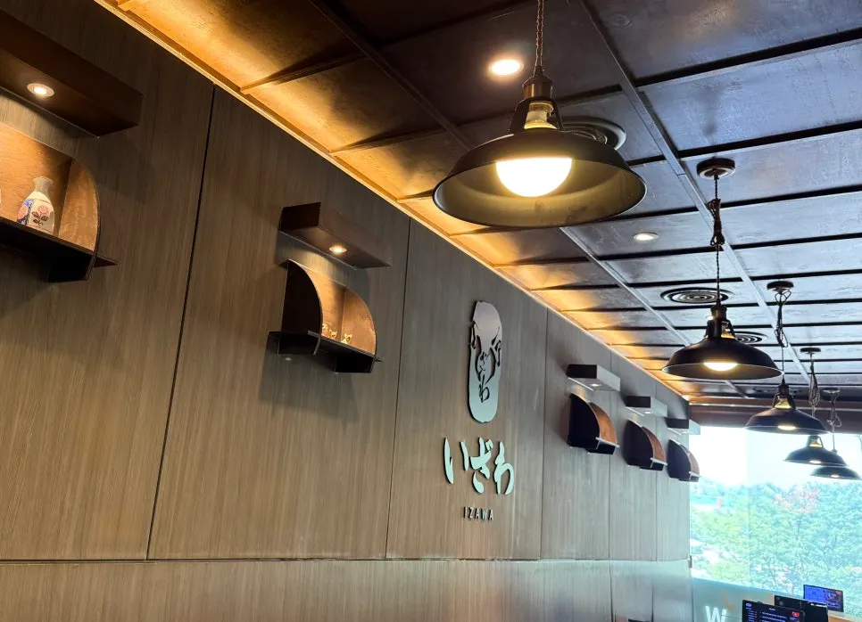 Dimly lit seating area inside Izawa Yeouido Direct Store