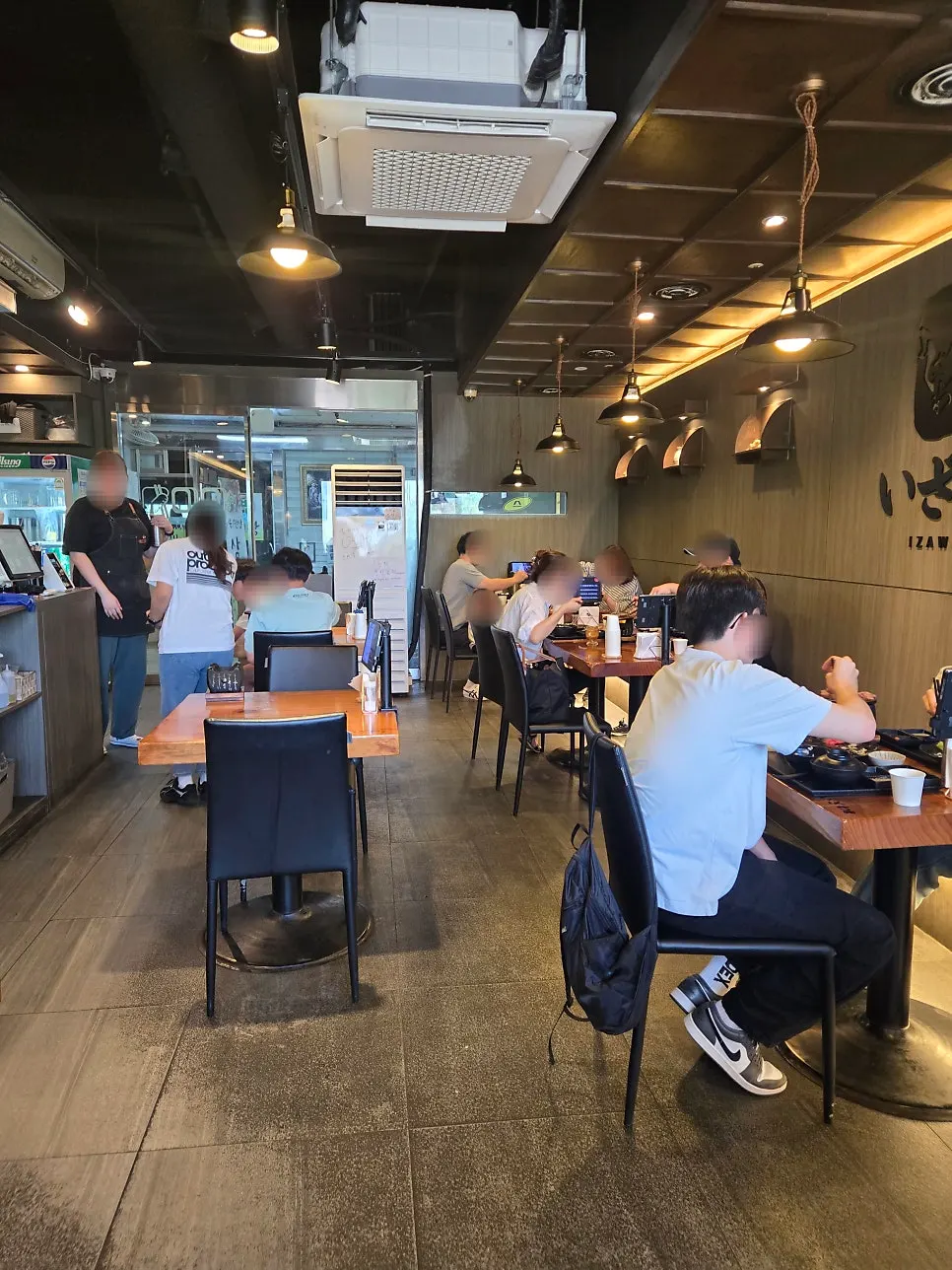 Izawa's tables bustling with customers
