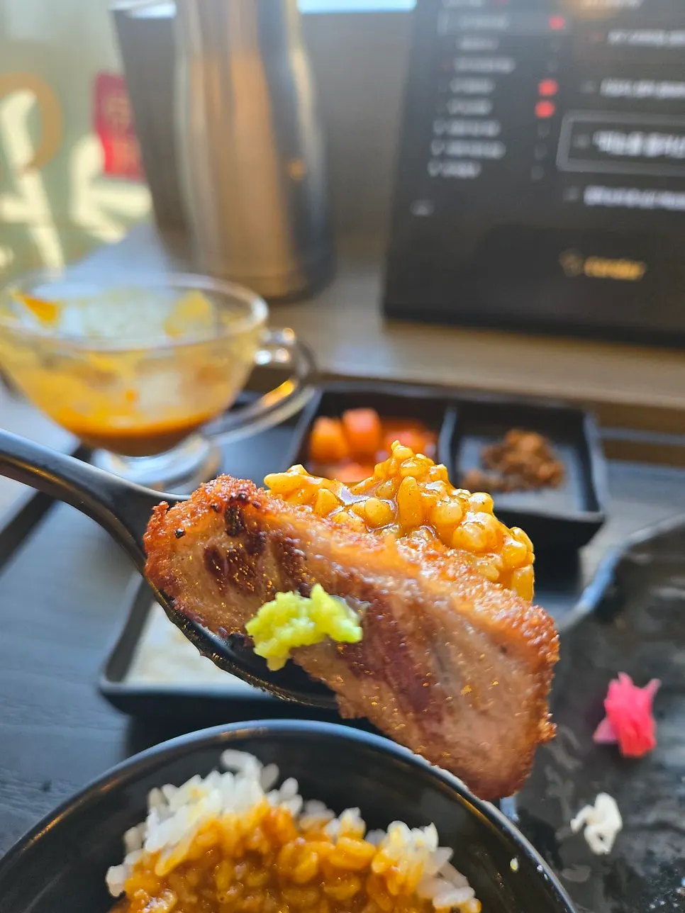 Curry sauce poured over leftover rice topped with gyukatsu