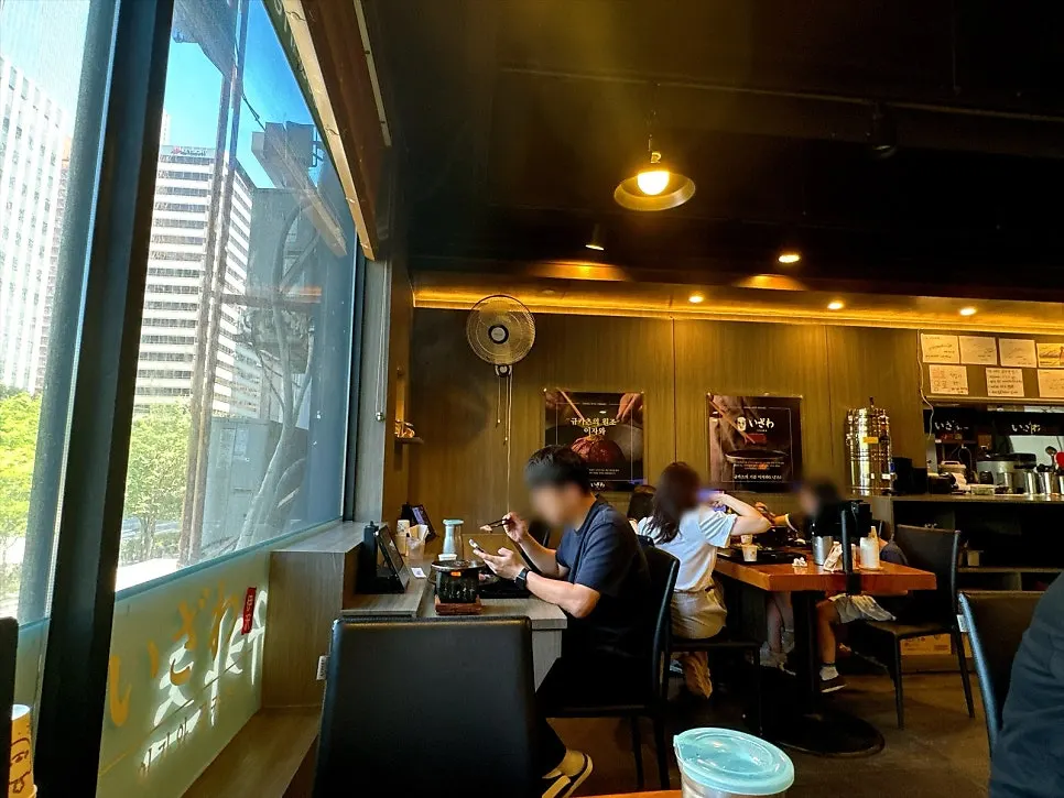 Low-lit interior of Izawa Yeouido Direct Store