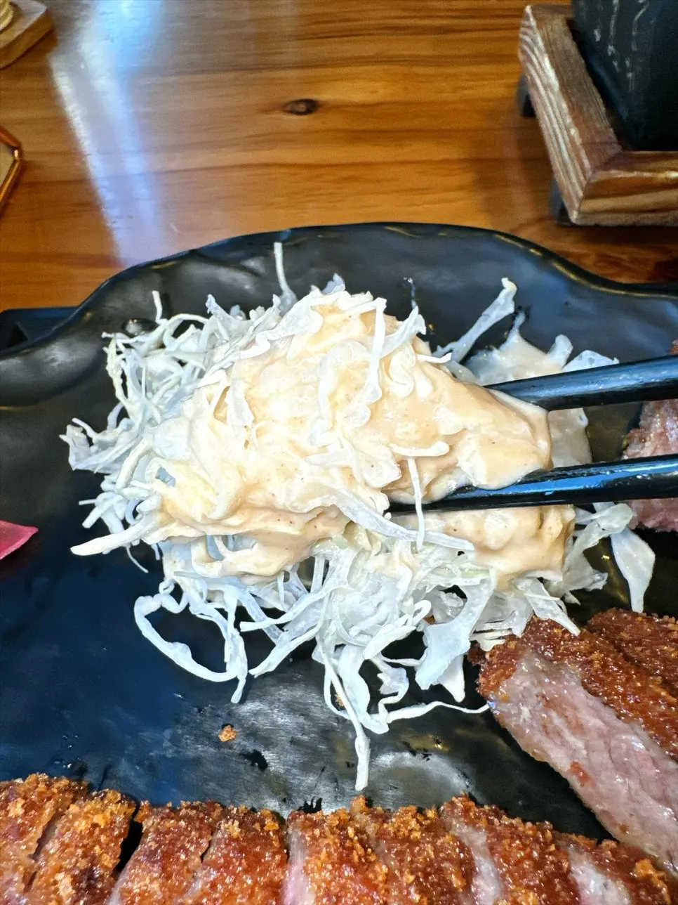 A bite combining curry and gyukatsu together