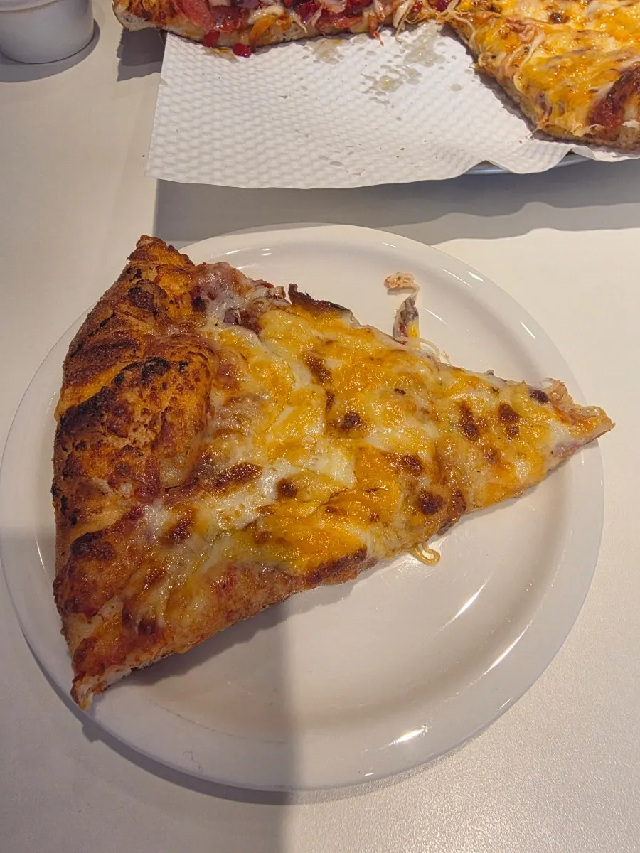 A slice of the Five Cheese pizza