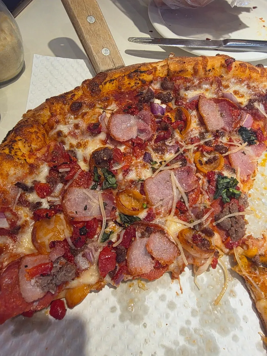 A slice of the topping-loaded Super Jackson pizza