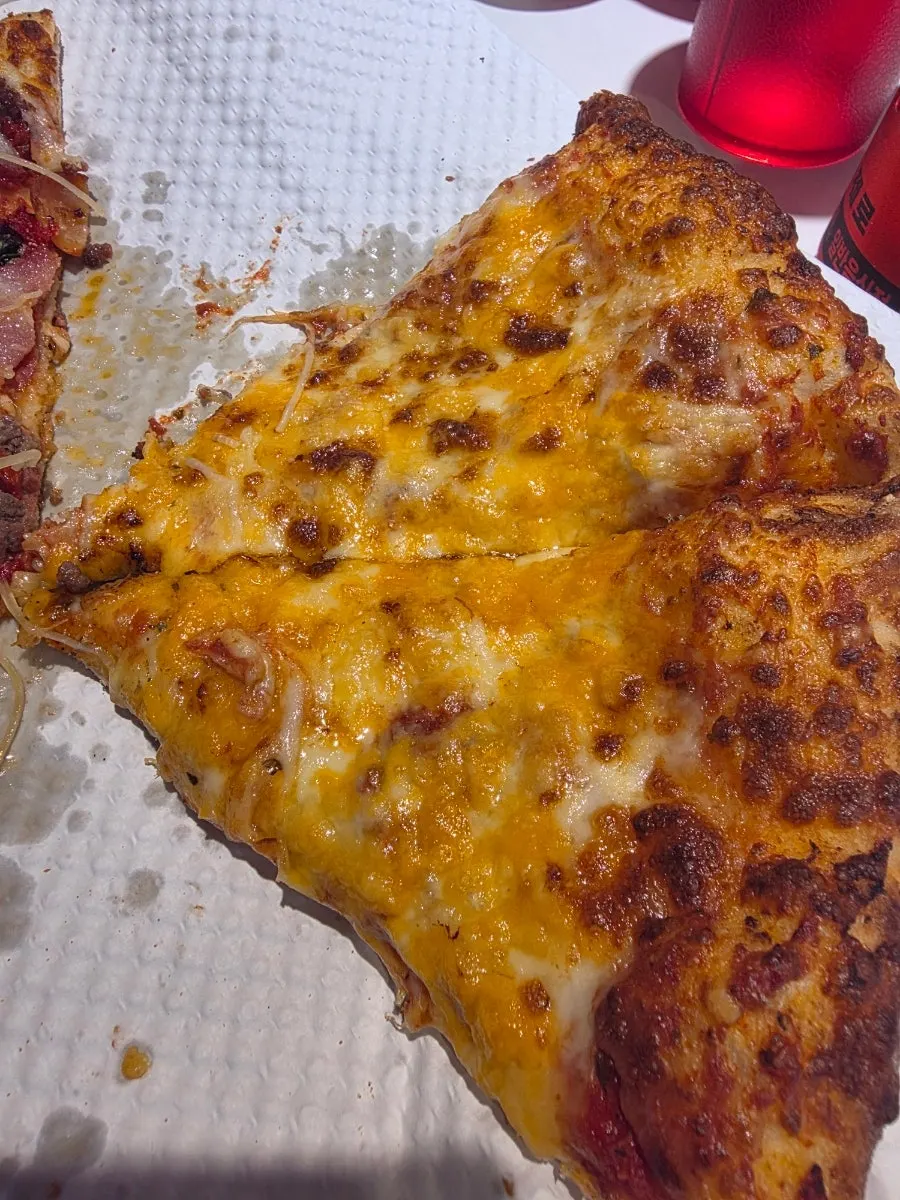 Pizza and side dishes on the table