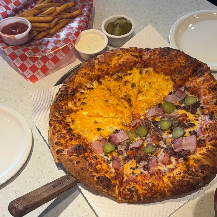 Large half-and-half pizza set on the table