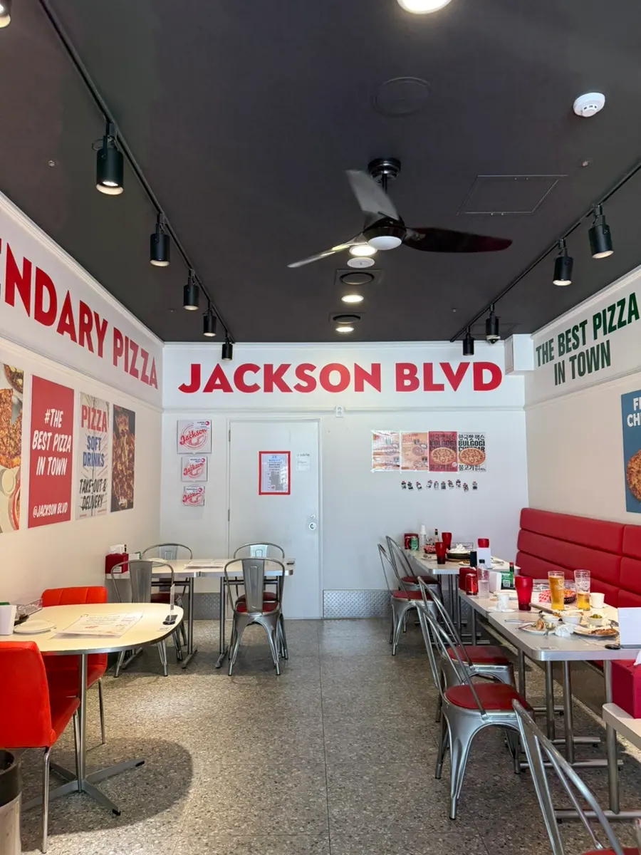 Sign about Jackson Pizza's pregnancy perk