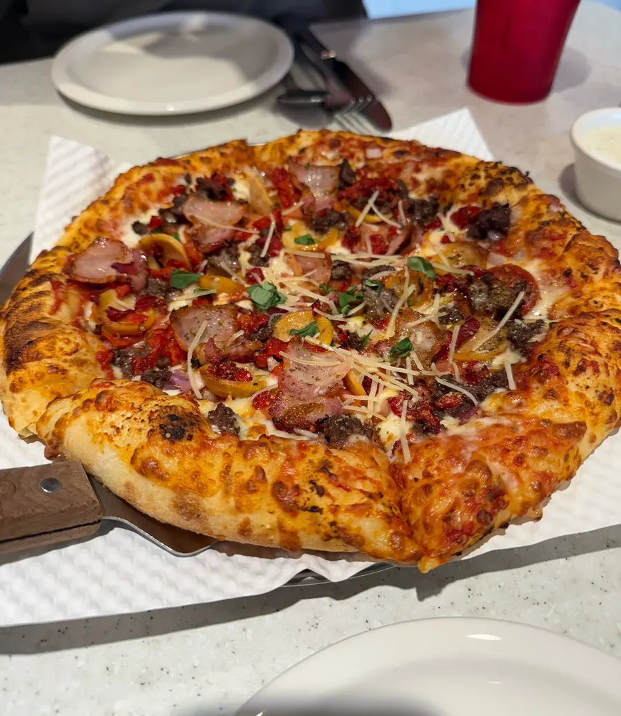 Full meal spread with the pizza and Zero Coke