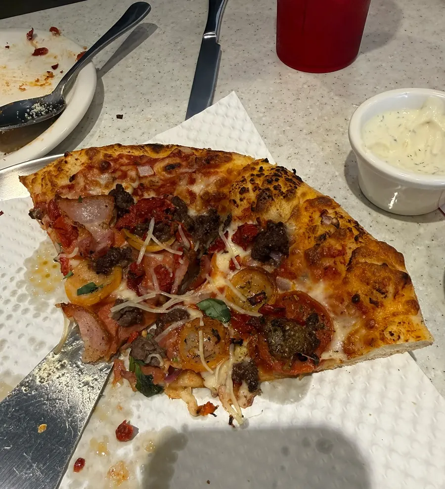 Half a pizza remaining in the pan