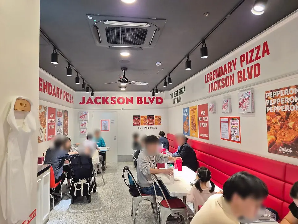 Tables at Jackson Pizza Wirye Branch full of families