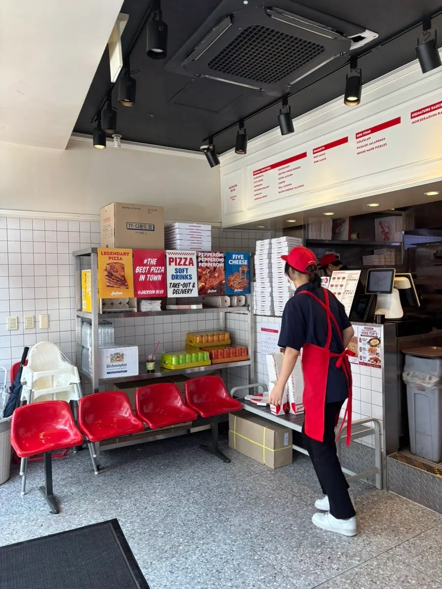 Discount information posted inside Jackson Pizza Wirye Branch