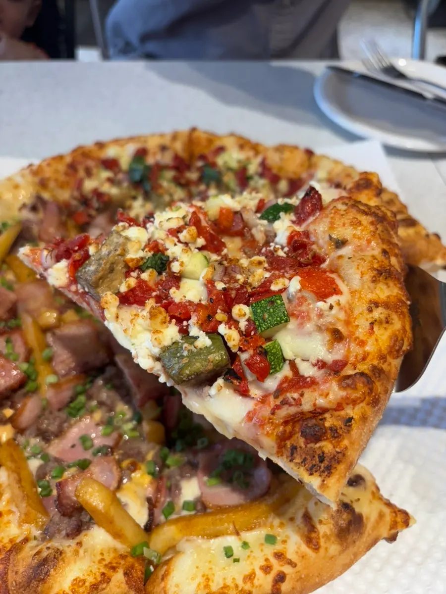 Half-and-half large pizza with Zesty Jackson and Greekology
