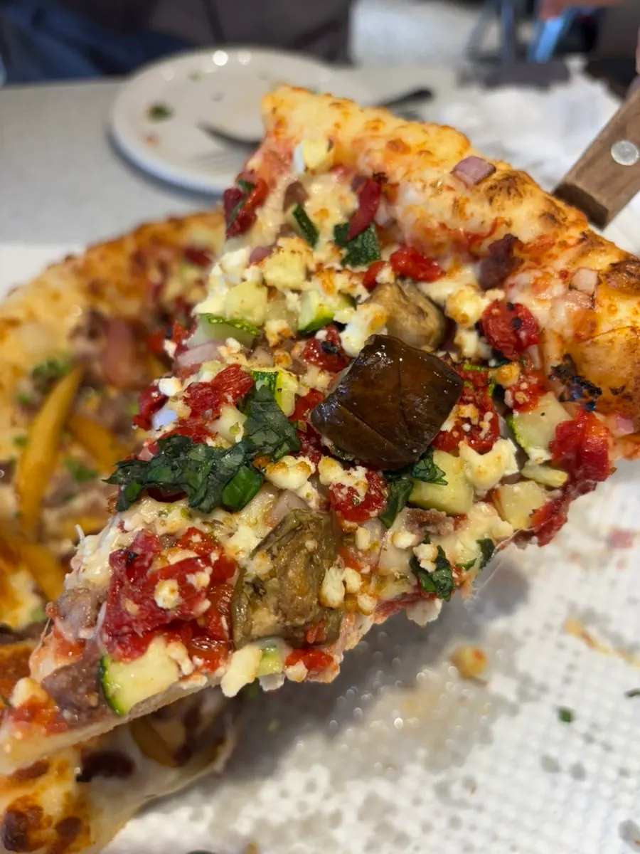 House-made ranch sauce served alongside the pizza