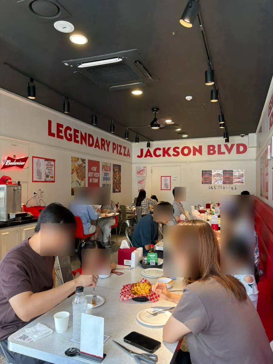 Jackson Pizza Wirye Branch interior full of weekend lunch guests