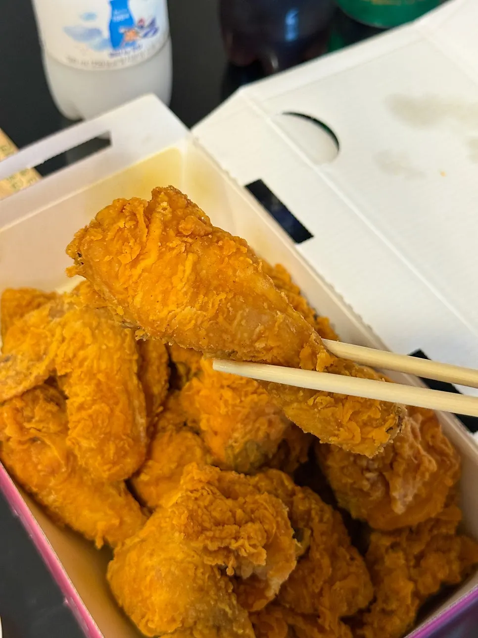 Opening up the takeout chicken box