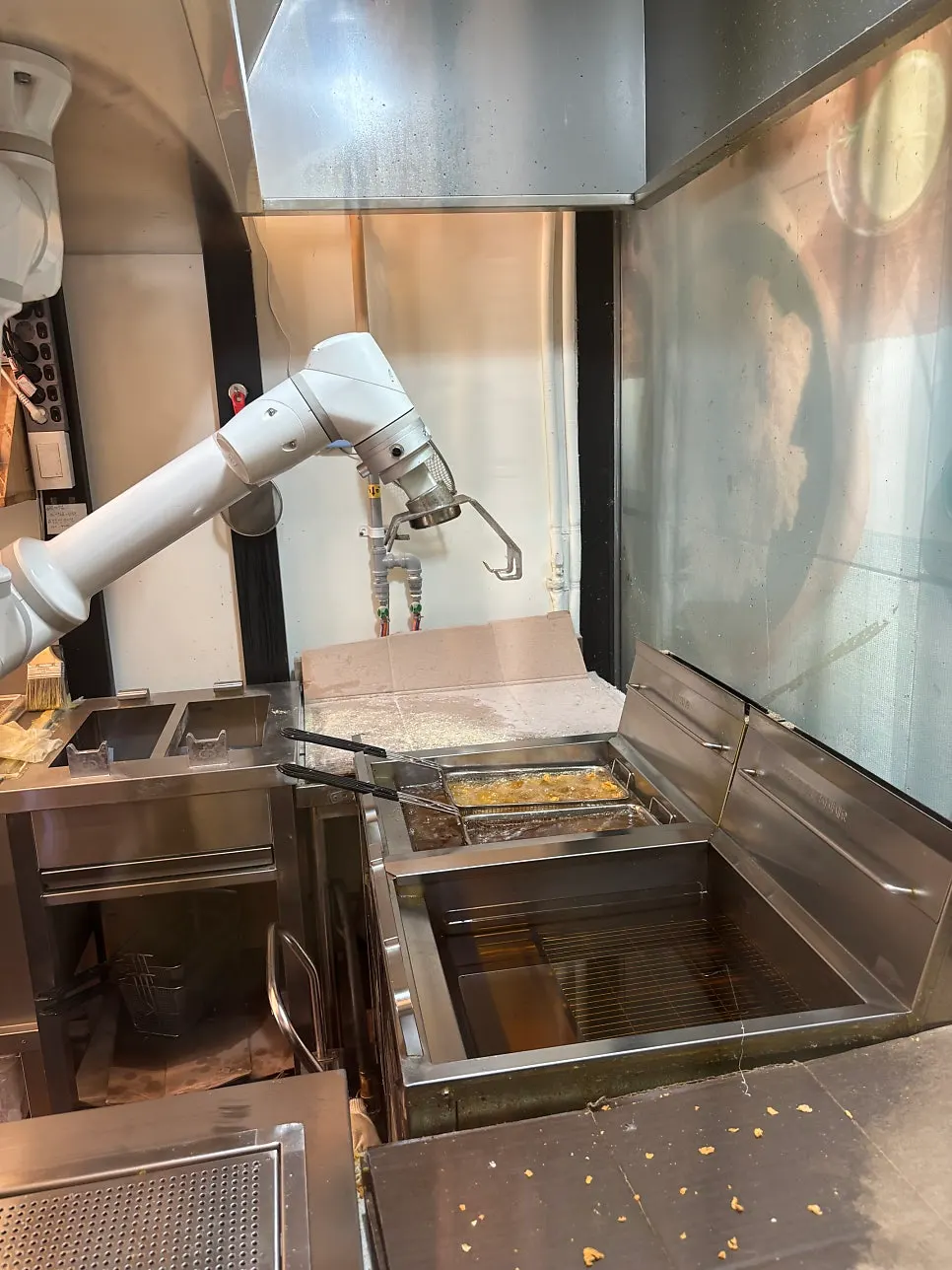 The chicken robot frying chicken inside the store