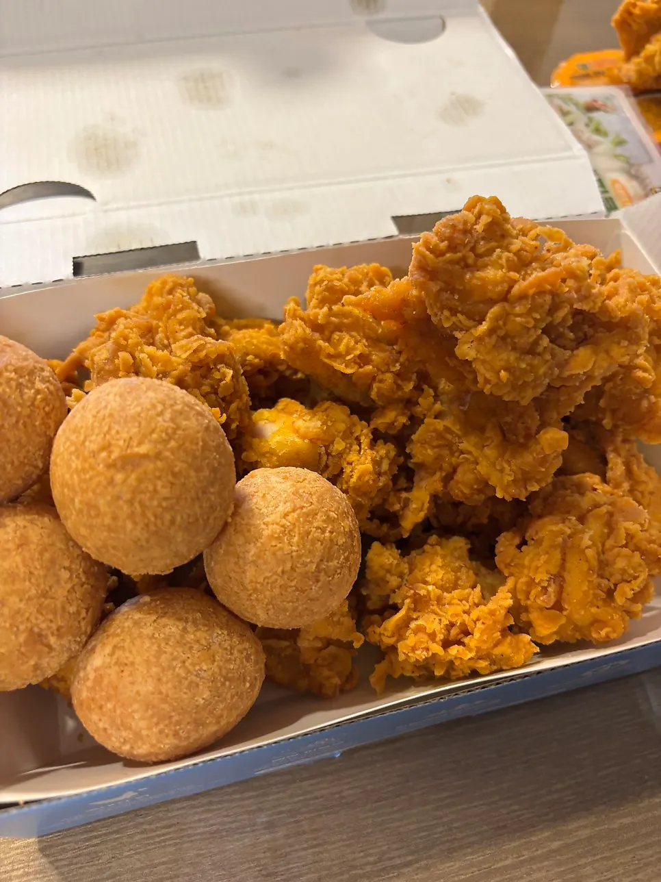 Fried chicken and cheese ball dinner spread at the lodging