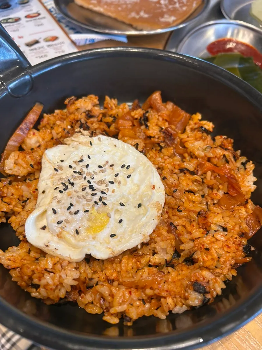 Pan-fried rice topped with a soft-boiled egg