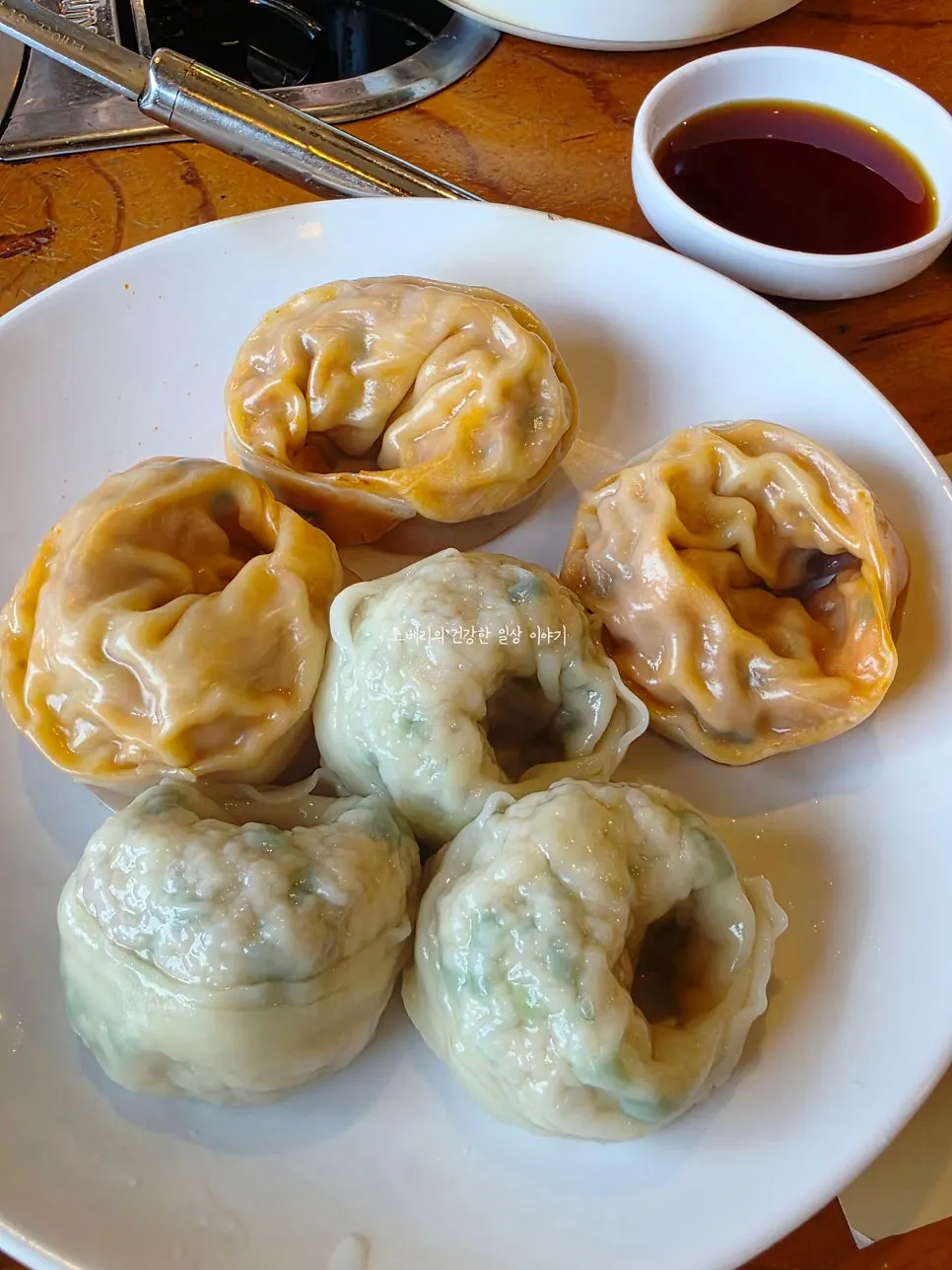 A plate of meat-kimchi half-and-half dumplings