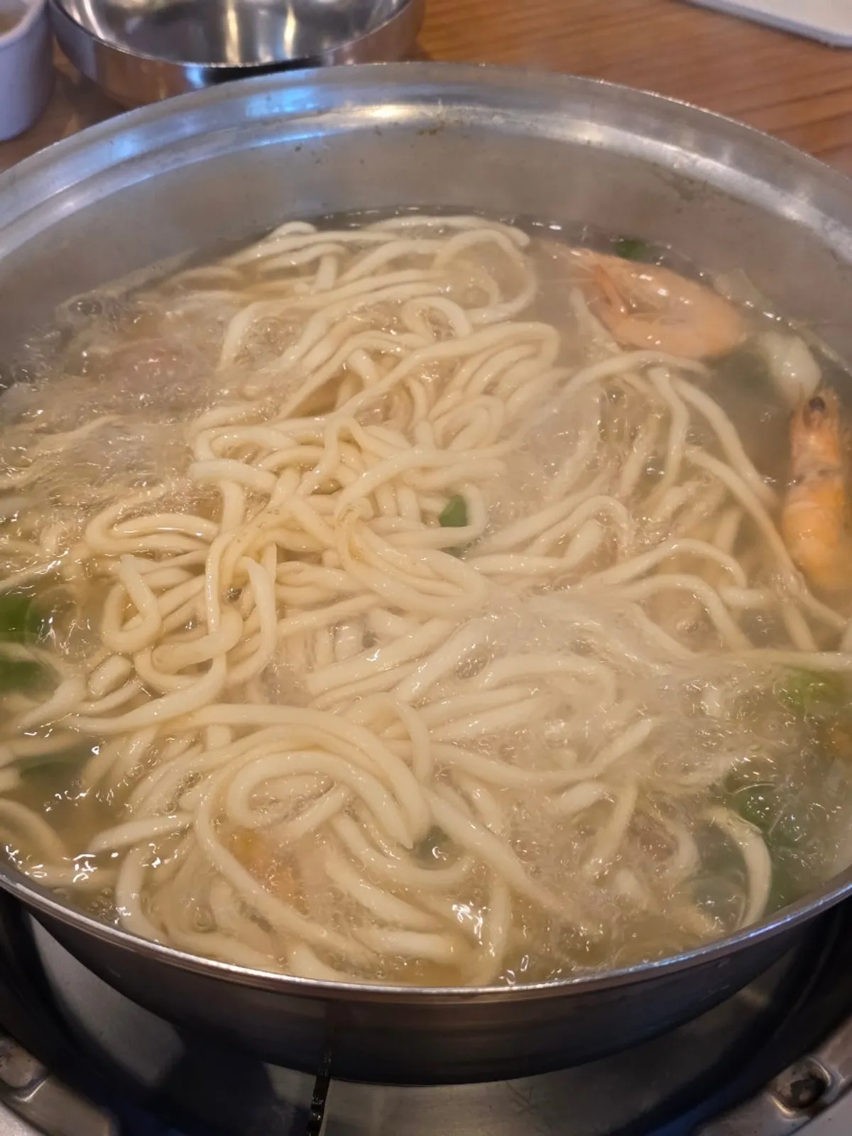 The finished clam kalguksu with shrimp and clams
