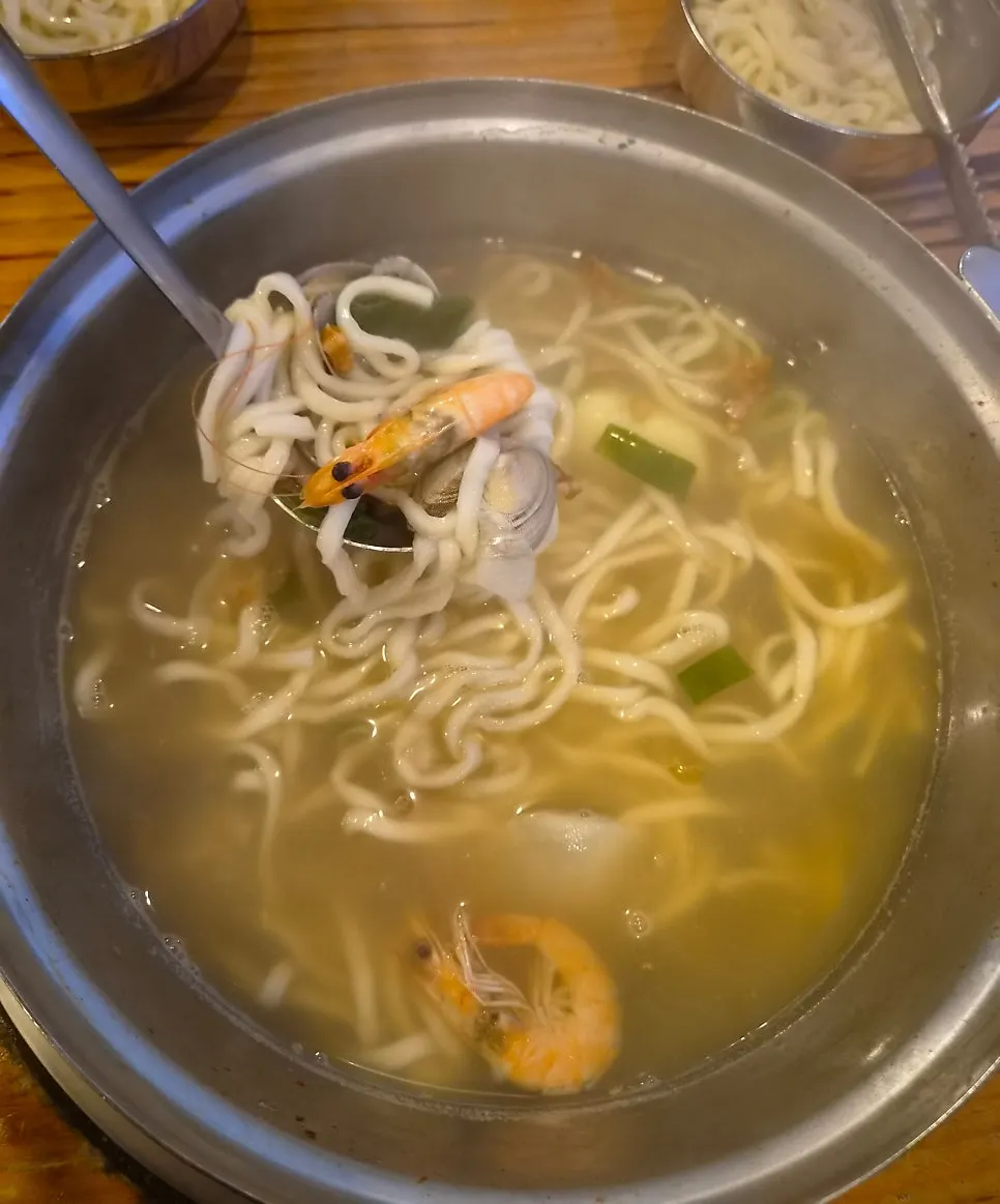 Bowl of kalguksu with clams and shrimp