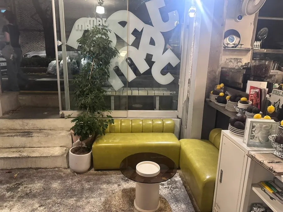 Mini sofa seating and a small table near the entrance