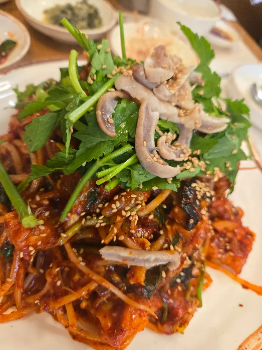 Monkfish and bean sprouts mixed together in the stew