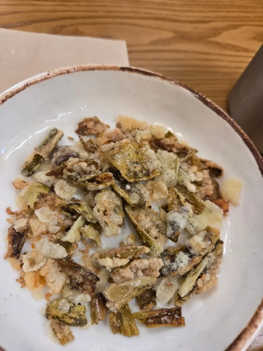 Picking up a piece of monkfish with chopsticks