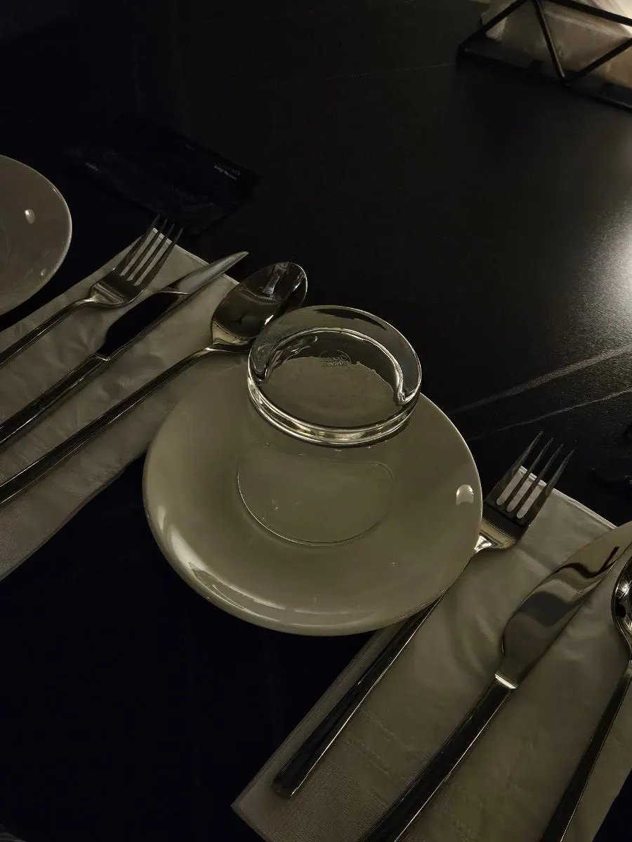 A two-person table at Allegro arranged to face the stage
