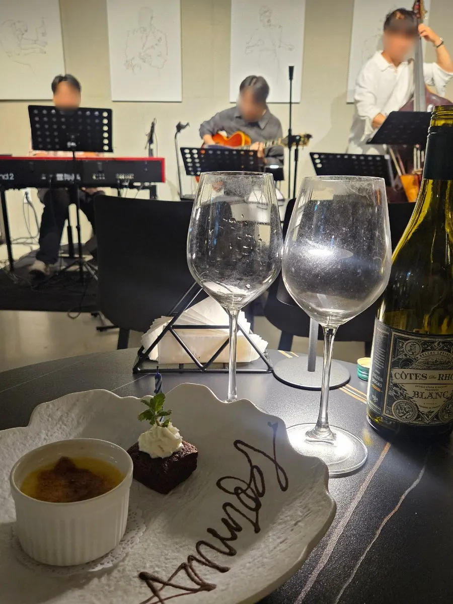 Anniversary lettering dessert with crème brûlée, brownie, and a candle