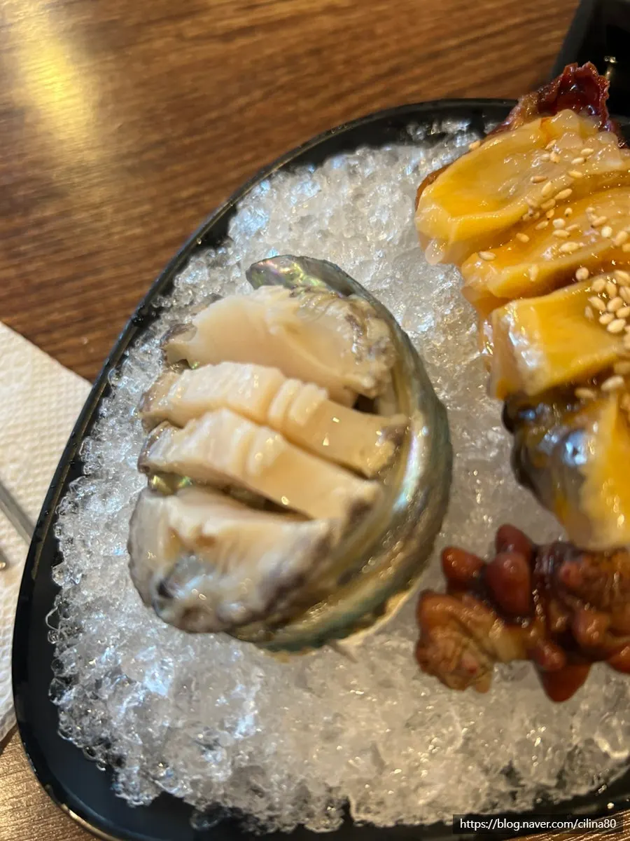Free abalone sashimi from the review event