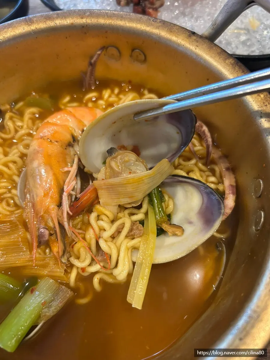 Clams and vegetables inside the seafood ramyeon