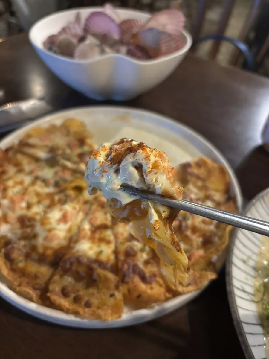 Cheese stretching from the pollock roe cheese potato jeon