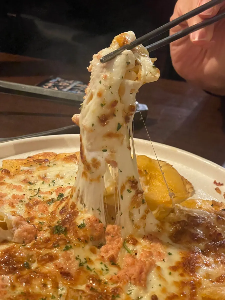 Potato pancake piled high with pollock roe and cheese