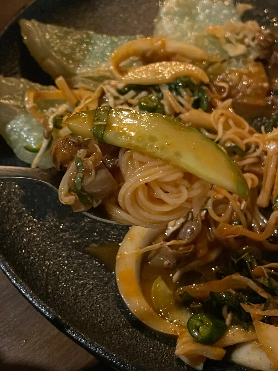 Seasoned sea snails and crispy flat dumplings