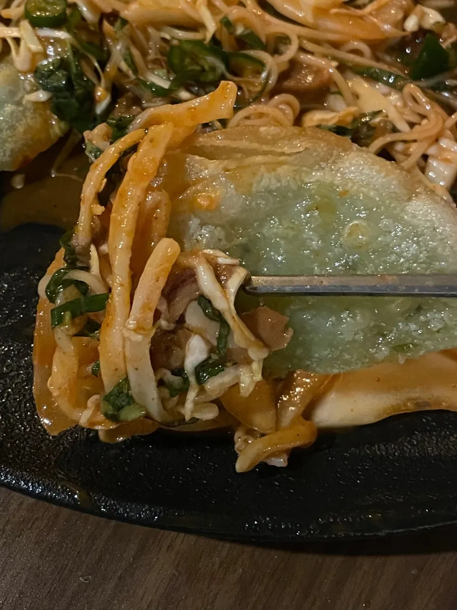 Sea snails with noodles served with cucumber
